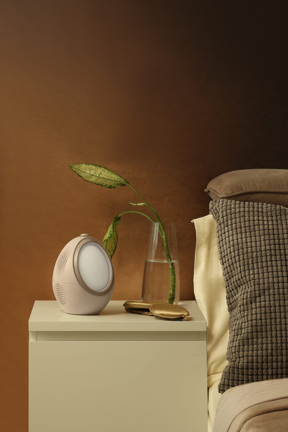 The Naptick device glowing on a bedside table